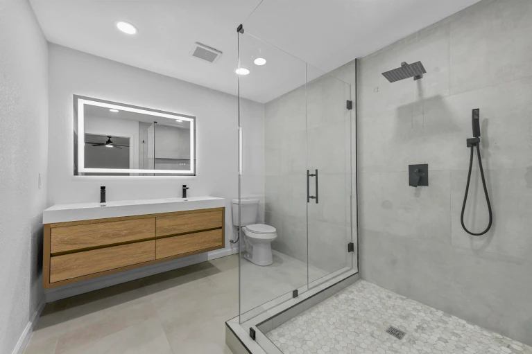 Spring Valley Drive Bedford TX primary bath with glass shower