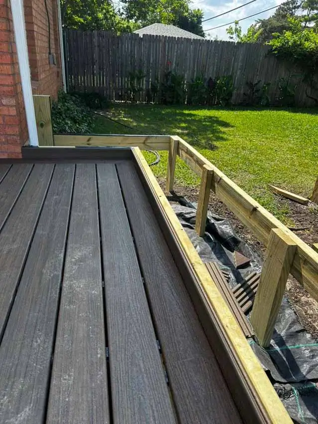 Composite Decking Beside An Unfinished Framed Extension Toward The 018