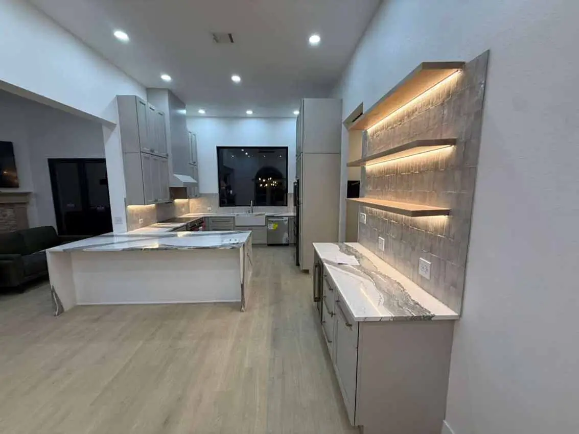 Open Remodeled Kitchen With Waterfall Island And Illuminated Display 055