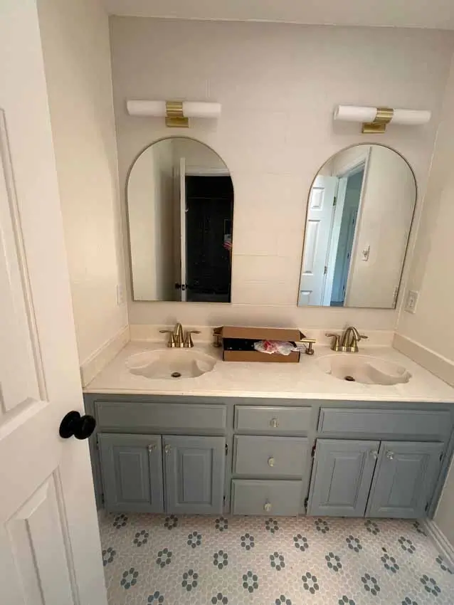 Remodeled Children S Bathroom With Gray Double Vanity Arched Mirrors Patterned 002