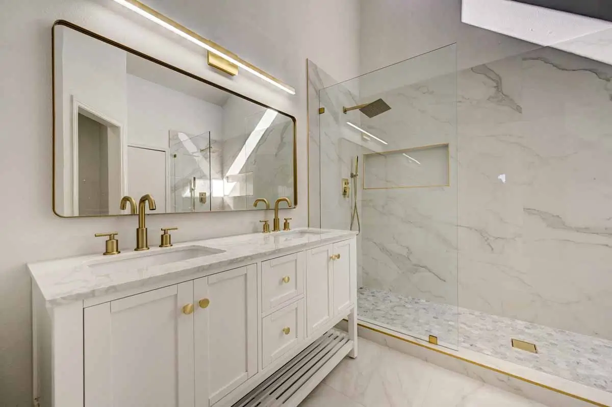Remodeled Primary Bathroom With White Double Vanity Marble Look Shower And 008