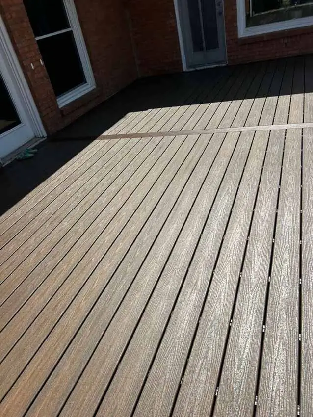 Wide Section Of Installed Wood Look Composite Decking Behind The 022
