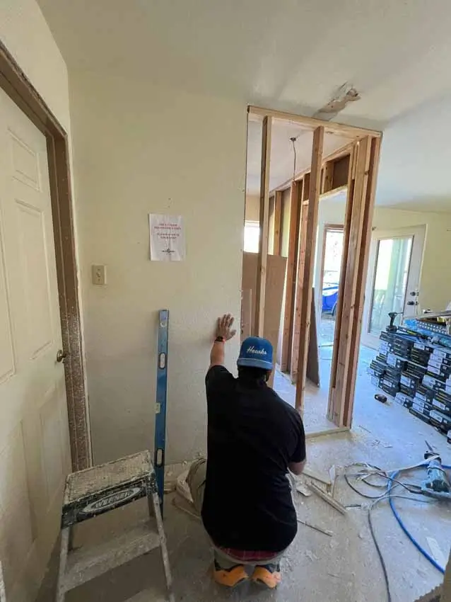 Worker Framing A New Interior Opening During The Whole Home Renovation 022